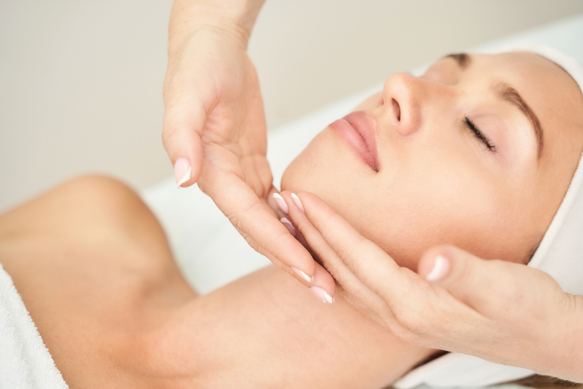 Woman Having Facial Massage Inside Spa